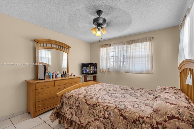 13325 SW 32nd St, Miami, FL 33175 - bedroom with light tile patterned floors, a textured ceiling, and ceiling fan