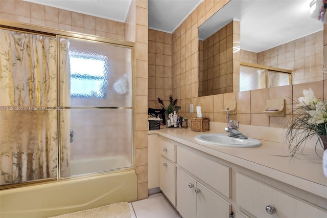 13325 SW 32nd St, Miami, FL 33175 - bathroom with tile walls, tasteful backsplash, vanity, shower / bath combination with glass door, and crown molding