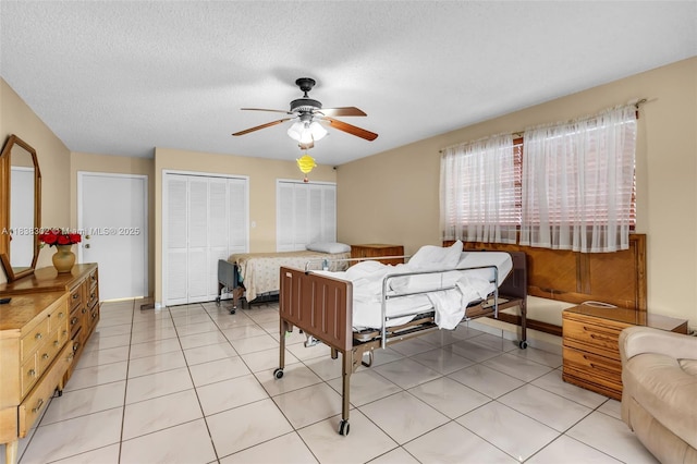 13325 SW 32nd St, Miami, FL 33175 - bedroom with ceiling fan, a textured ceiling, and light tile patterned floors
