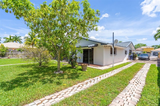 13325 SW 32nd St, Miami, FL 33175 - rear view of property featuring stucco siding and driveway