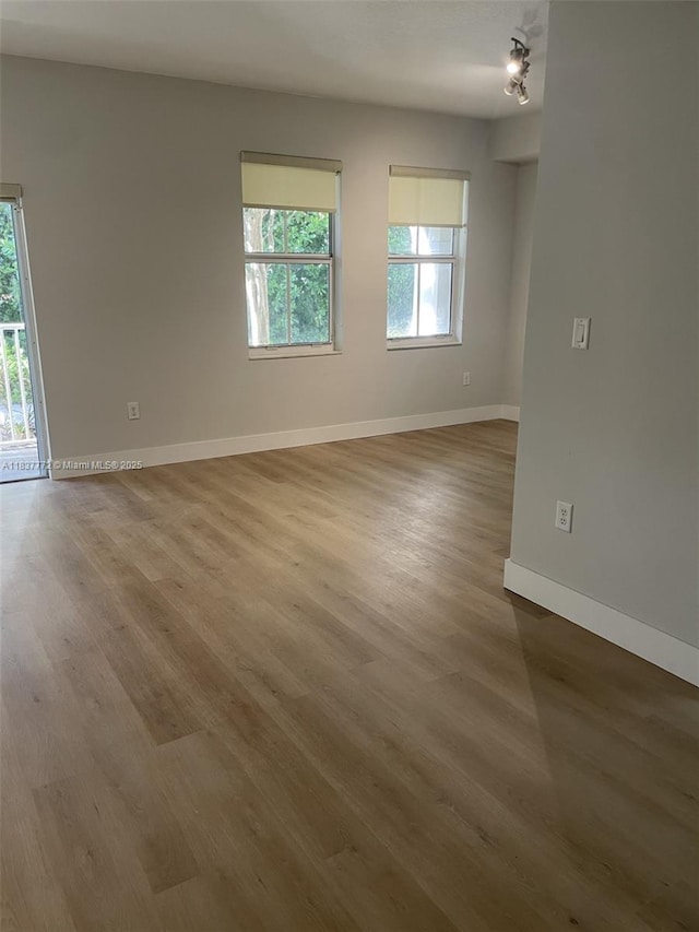11605 NW 89th St Unit 112, Doral, FL 33178 - unfurnished room with wood finished floors