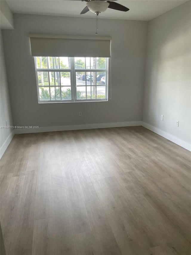 11605 NW 89th St Unit 112, Doral, FL 33178 - unfurnished room featuring a ceiling fan and wood finished floors
