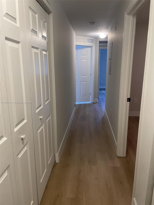 11605 NW 89th St Unit 112, Doral, FL 33178 - corridor with wood finished floors and baseboards