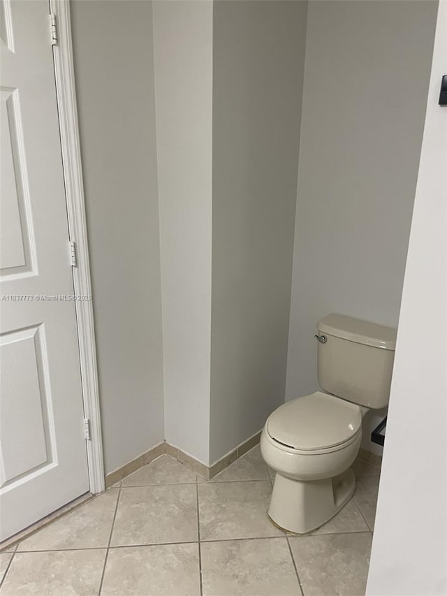 11605 NW 89th St Unit 112, Doral, FL 33178 - bathroom featuring toilet and tile patterned flooring