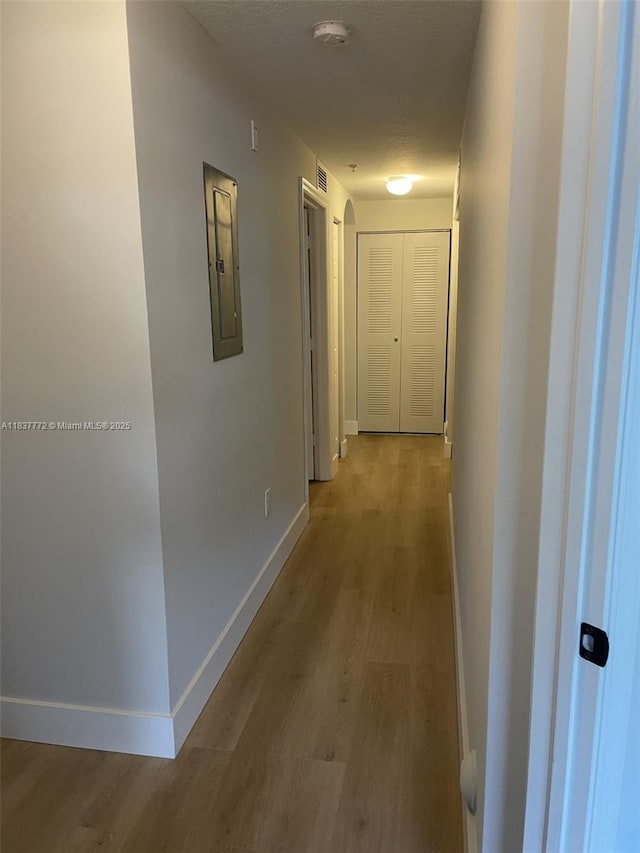 11605 NW 89th St Unit 112, Doral, FL 33178 - hall with electric panel and wood finished floors