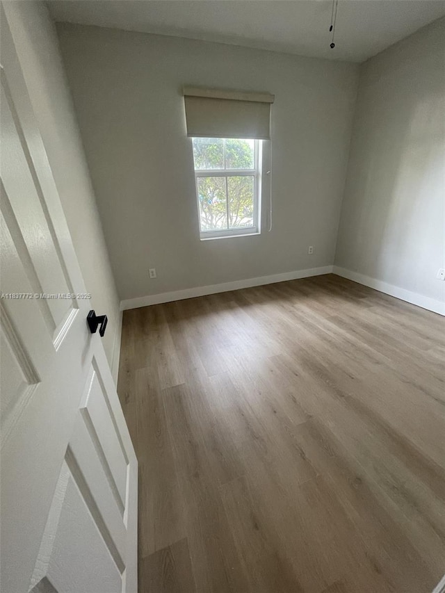 11605 NW 89th St Unit 112, Doral, FL 33178 - unfurnished room with wood finished floors and baseboards