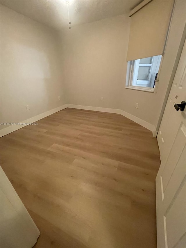 11605 NW 89th St Unit 112, Doral, FL 33178 - unfurnished room with wood finished floors