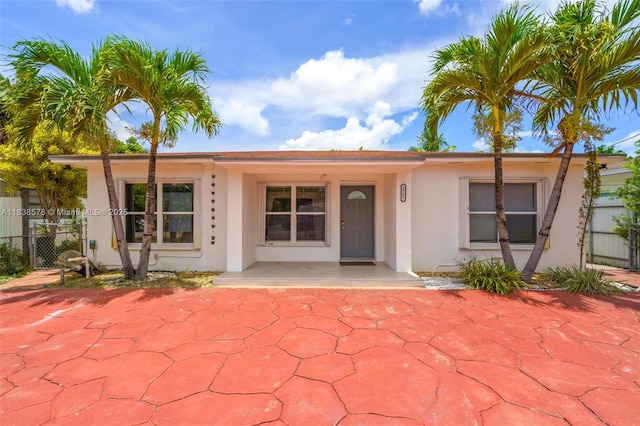 2761 SW 33rd Ct, Miami, FL 33133 - view of front of house featuring stucco siding and a porch