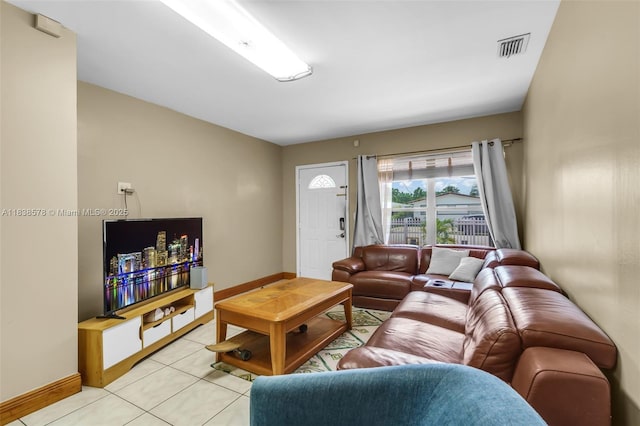 2761 SW 33rd Ct, Miami, FL 33133 - living room featuring baseboards and light tile patterned floors