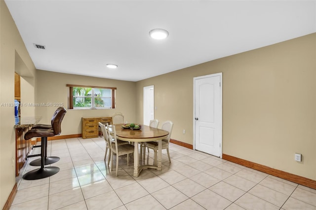 2761 SW 33rd Ct, Miami, FL 33133 - dining room with baseboards and light tile patterned floors