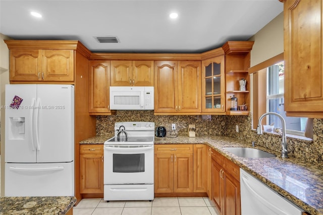 2761 SW 33rd Ct, Miami, FL 33133 - kitchen with white appliances, stone countertops, tasteful backsplash, light tile patterned flooring, and recessed lighting