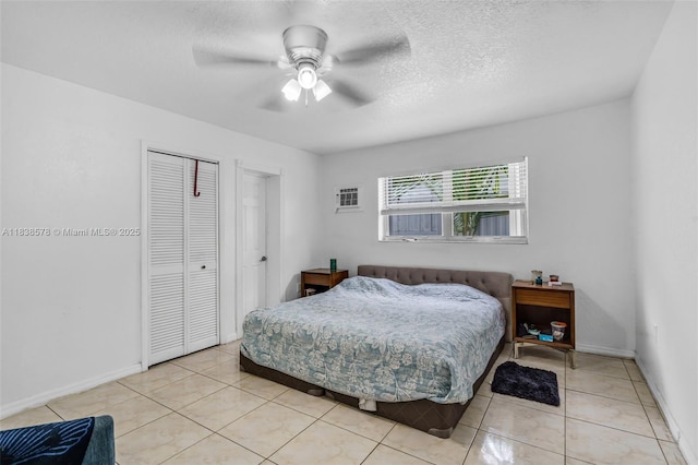 2761 SW 33rd Ct, Miami, FL 33133 - bedroom with a closet, light tile patterned flooring, a ceiling fan, and a textured ceiling