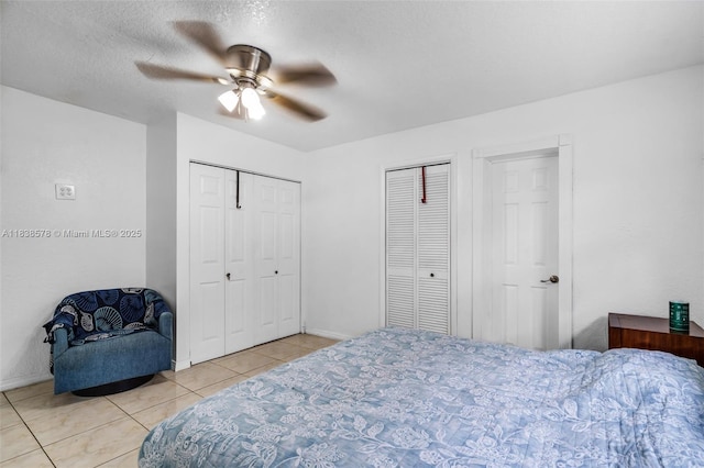 2761 SW 33rd Ct, Miami, FL 33133 - tiled bedroom with two closets and ceiling fan