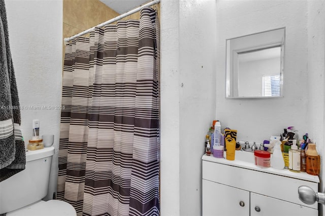 2761 SW 33rd Ct, Miami, FL 33133 - bathroom featuring vanity, a textured wall, and a shower with shower curtain