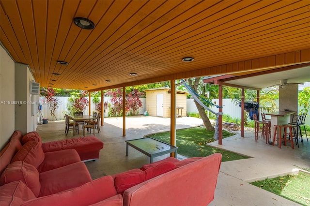 2761 SW 33rd Ct, Miami, FL 33133 - fenced backyard featuring a patio area, an outdoor living space, a shed, and outdoor dining space