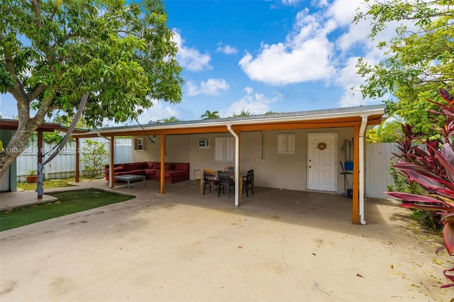 2761 SW 33rd Ct, Miami, FL 33133 - rear view of property with outdoor lounge area, a patio area, and stucco siding