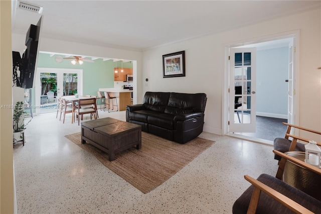 1112 N 31st Ave, Hollywood, FL 33021 - living room featuring speckle patterned floor, a ceiling fan, french doors, and ornamental molding