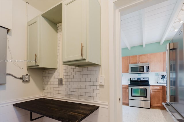 1112 N 31st Ave, Hollywood, FL 33021 - kitchen featuring stainless steel appliances, beam ceiling, backsplash, and light countertops