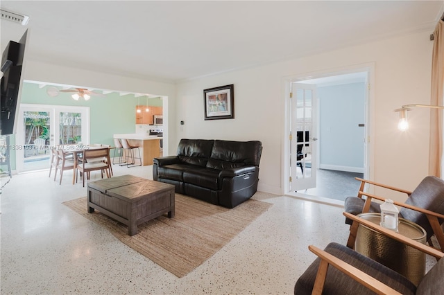 1112 N 31st Ave, Hollywood, FL 33021 - living area with speckled floor and a ceiling fan