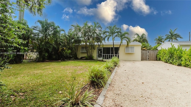 1112 N 31st Ave, Hollywood, FL 33021 - view of front of house featuring gravel driveway and stucco siding