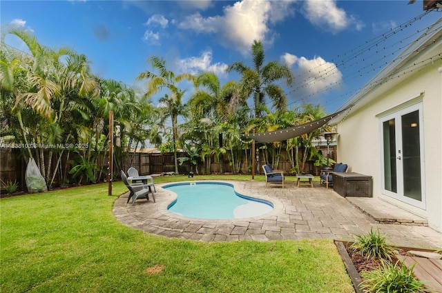 1112 N 31st Ave, Hollywood, FL 33021 - view of swimming pool featuring a patio, a fenced backyard, and french doors