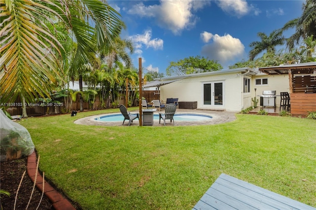 1112 N 31st Ave, Hollywood, FL 33021 - fenced backyard featuring french doors and a patio area