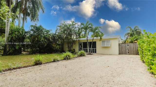 1112 N 31st Ave, Hollywood, FL 33021 - back of house with stucco siding and driveway