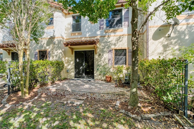 6973 Broadland Way, Coconut Creek, FL 33073 - back of house featuring stucco siding and a patio