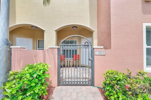 2851 W Prospect Rd Unit 1306, Tamarac, FL 33309 - entrance to property featuring stucco siding and a gate