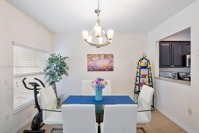 2851 W Prospect Rd Unit 1306, Tamarac, FL 33309 - dining space with a chandelier and light tile patterned flooring