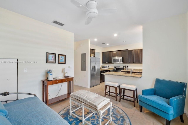 2851 W Prospect Rd Unit 1306, Tamarac, FL 33309 - living room featuring light tile patterned floors, ceiling fan, electric panel, and recessed lighting