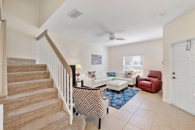 2851 W Prospect Rd Unit 1306, Tamarac, FL 33309 - living room featuring a ceiling fan, stairs, and light tile patterned floors