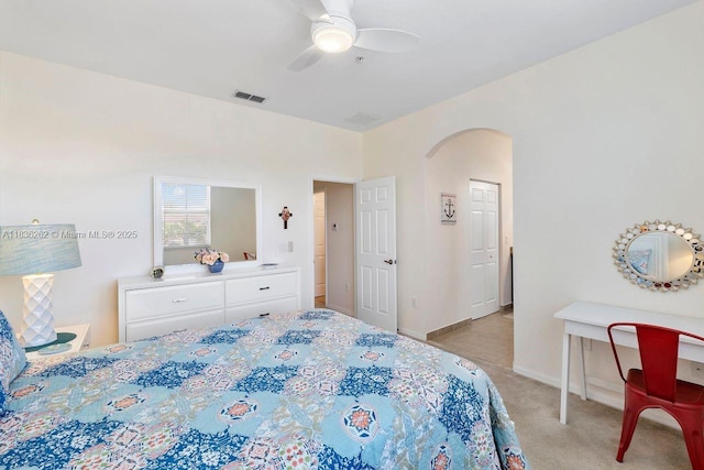 2851 W Prospect Rd Unit 1306, Tamarac, FL 33309 - bedroom with light colored carpet, arched walkways, and a ceiling fan