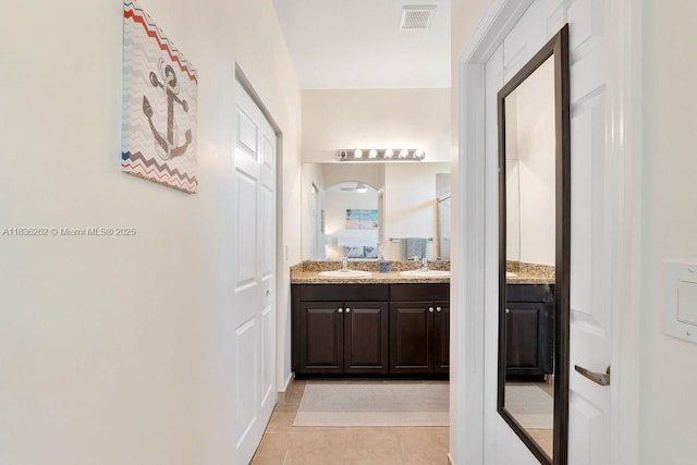 2851 W Prospect Rd Unit 1306, Tamarac, FL 33309 - full bath with double vanity and tile patterned flooring