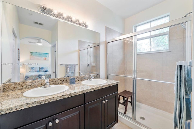 2851 W Prospect Rd Unit 1306, Tamarac, FL 33309 - ensuite bathroom featuring a stall shower and double vanity