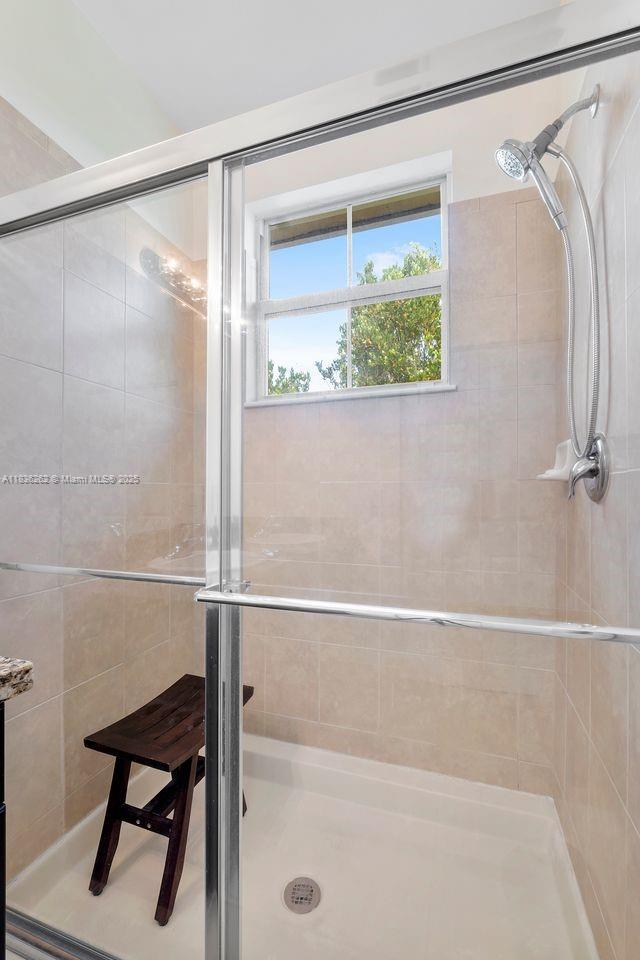 2851 W Prospect Rd Unit 1306, Tamarac, FL 33309 - bathroom with a shower stall