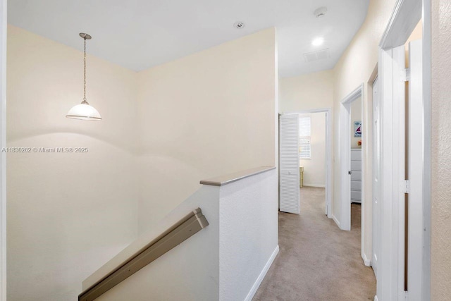 2851 W Prospect Rd Unit 1306, Tamarac, FL 33309 - corridor featuring an upstairs landing and light colored carpet