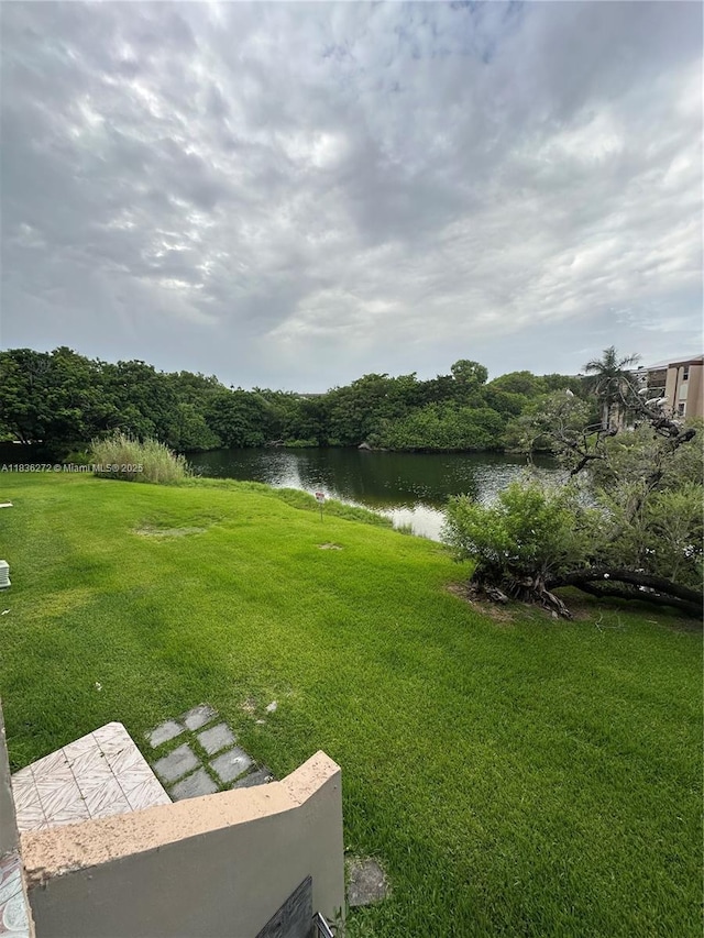 8897 Fontainebleau Blvd Unit 208, Miami, FL 33172 - view of grassy yard with a water view