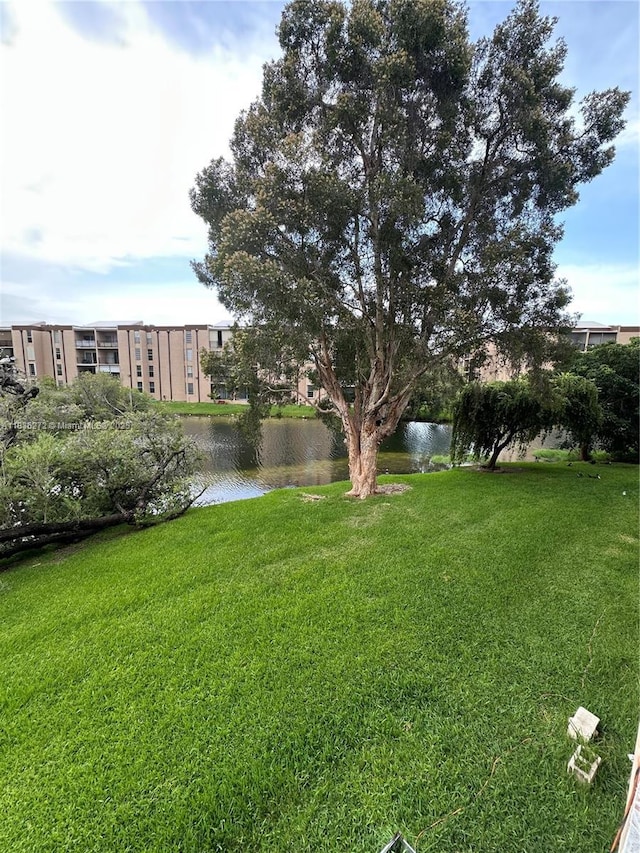 8897 Fontainebleau Blvd Unit 208, Miami, FL 33172 - view of grassy yard featuring a water view