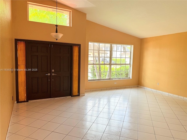 8973 NW 147th Ter, Miami Lakes, FL 33018 - entrance foyer with lofted ceiling, healthy amount of natural light, and light tile patterned flooring
