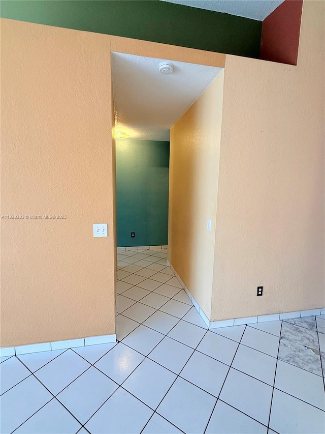 8973 NW 147th Ter, Miami Lakes, FL 33018 - corridor featuring light tile patterned flooring