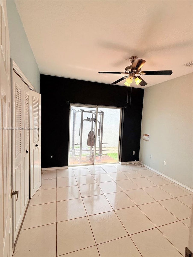 8973 NW 147th Ter, Miami Lakes, FL 33018 - empty room with ceiling fan and light tile patterned floors