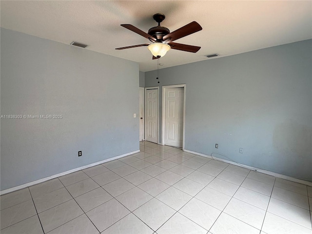8973 NW 147th Ter, Miami Lakes, FL 33018 - empty room with a ceiling fan and light tile patterned floors