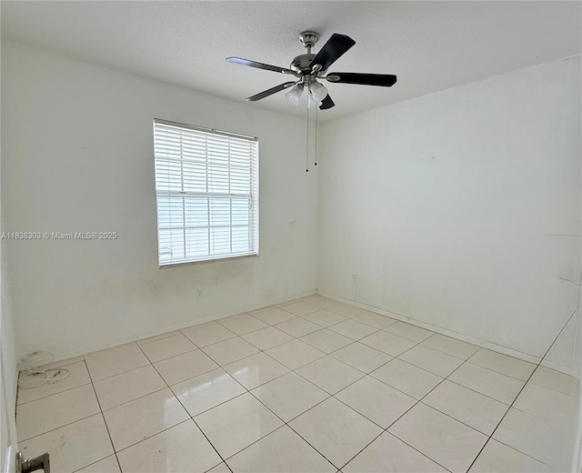 8973 NW 147th Ter, Miami Lakes, FL 33018 - empty room featuring light tile patterned floors and a ceiling fan