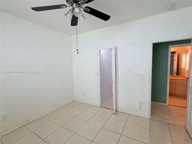 8973 NW 147th Ter, Miami Lakes, FL 33018 - empty room featuring ceiling fan, light tile patterned floors, and a smoke detector