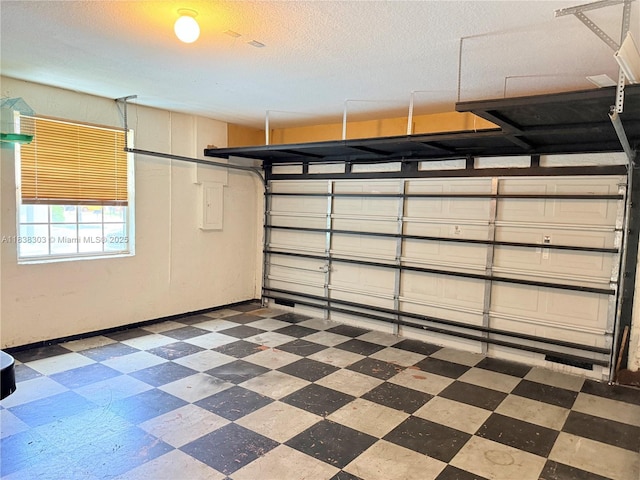 8973 NW 147th Ter, Miami Lakes, FL 33018 - garage featuring baseboards and electric panel