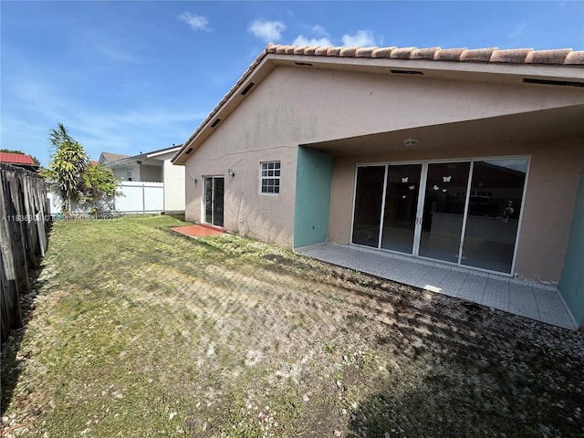 8973 NW 147th Ter, Miami Lakes, FL 33018 - rear view of house featuring stucco siding and a fenced backyard