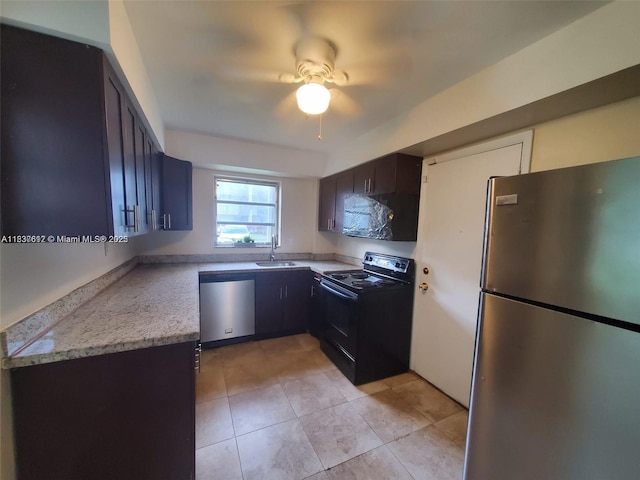 1450 NE 191st St Unit 106, Miami, FL 33179 - kitchen featuring stainless steel appliances, ceiling fan, light tile patterned flooring, and dark brown cabinetry