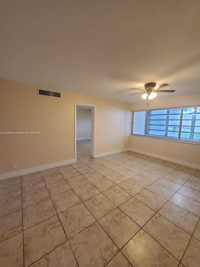 1450 NE 191st St Unit 106, Miami, FL 33179 - unfurnished room featuring ceiling fan and light tile patterned floors