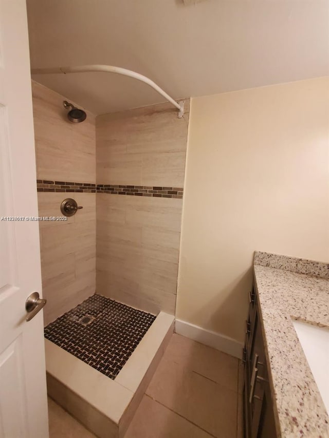 1450 NE 191st St Unit 106, Miami, FL 33179 - full bathroom with a tile shower, tile patterned floors, and vanity